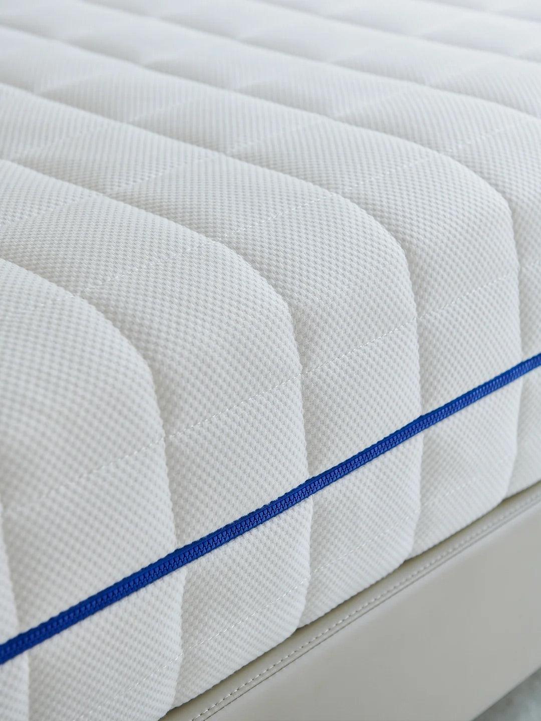 Celestial Cotton Luxe Zip-Pad Ivytress mattress pad featuring a zippered design, crafted from soft cotton to provide hypoallergenic protection against dust mites and allergens, enhancing sleep comfort